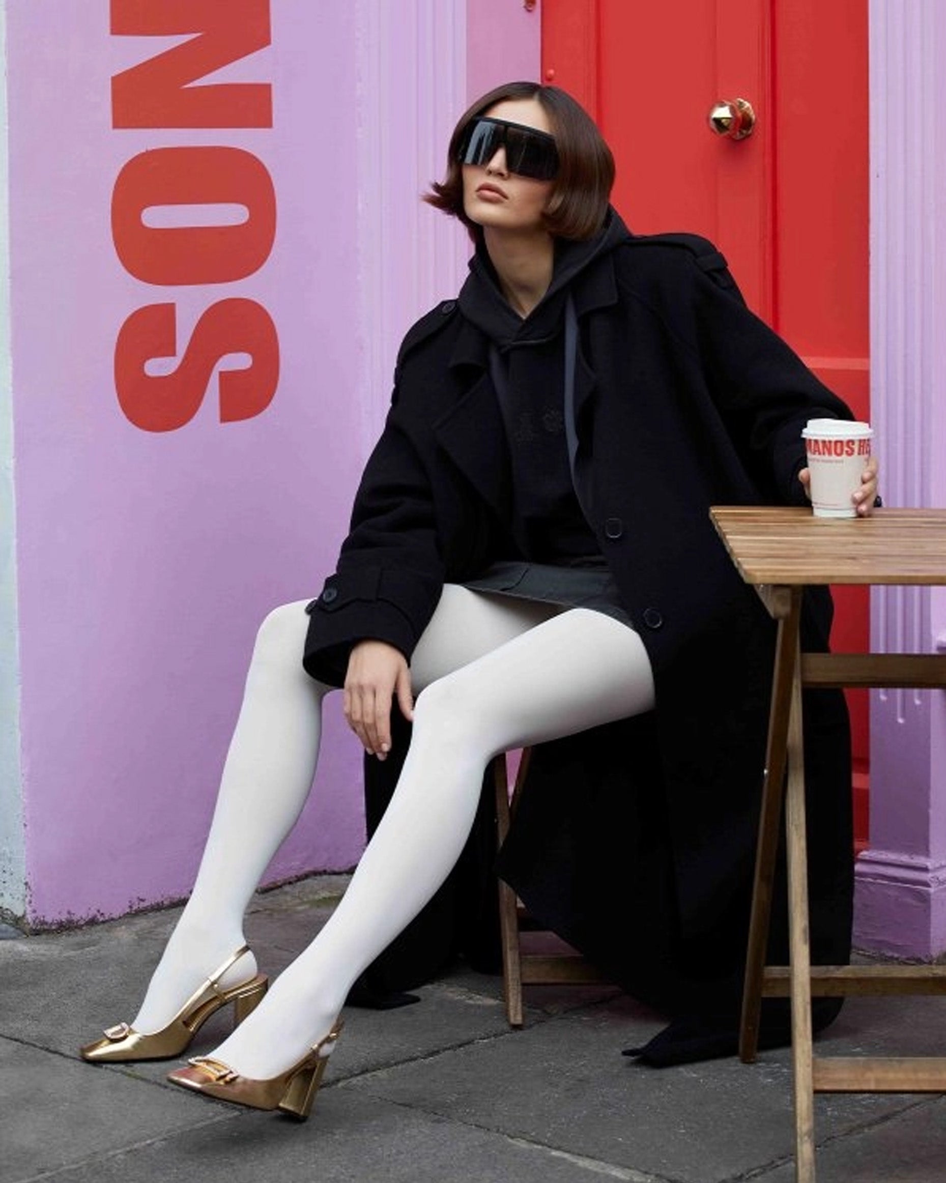 Calzitaly Opaque Tights - Cream opaque tights worn by brunette model wearing sunglasses, navy hoodie, trench coat and gold heels.