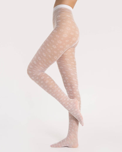 Fiore Footloose Tights - Sheer white micro mesh fashion tights with an all over woven small daisy style flower pattern. Side view.