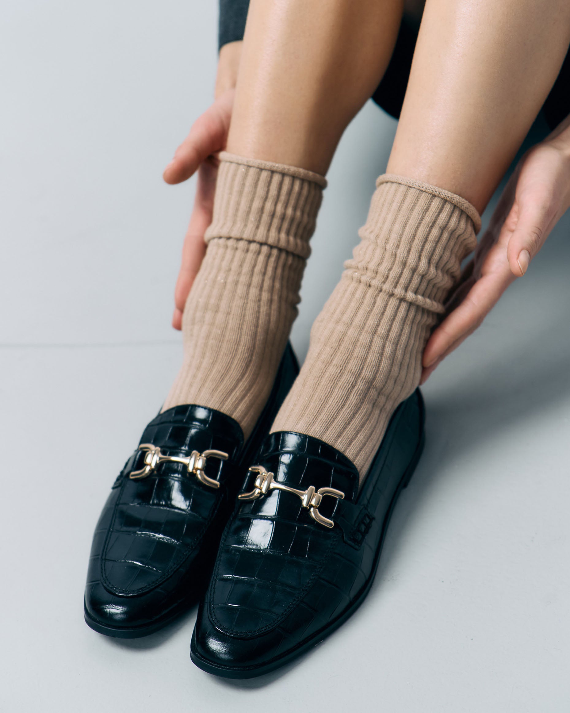 Fiore Trinny Socks - Chunky deep ribbed beige socks with sparkly gold lurex throughout and no cuff, roll top edge. Worn with back crocodile loafers.