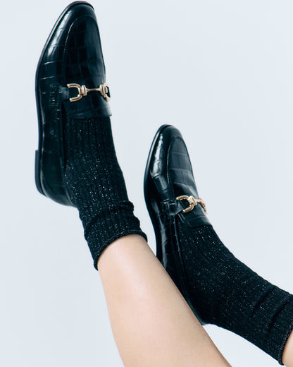 Fiore Trinny Socks - Chunky deep ribbed black socks with sparkly silver lurex throughout and no cuff, roll top edge. Worn with black patent crocodile loafers.