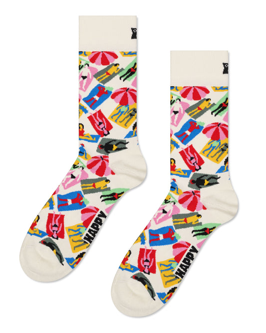 Happy Days Lazy Days Sock - Cream cotton crew length ankle socks with a multicoloured all over pattern of parasols and sun bathers on towels.