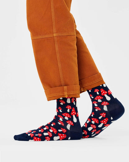 Happy Socks Mushroom Socks - Navy cotton crew socks with an all over red and cream mushroom pattern worn with orange cropped pants.