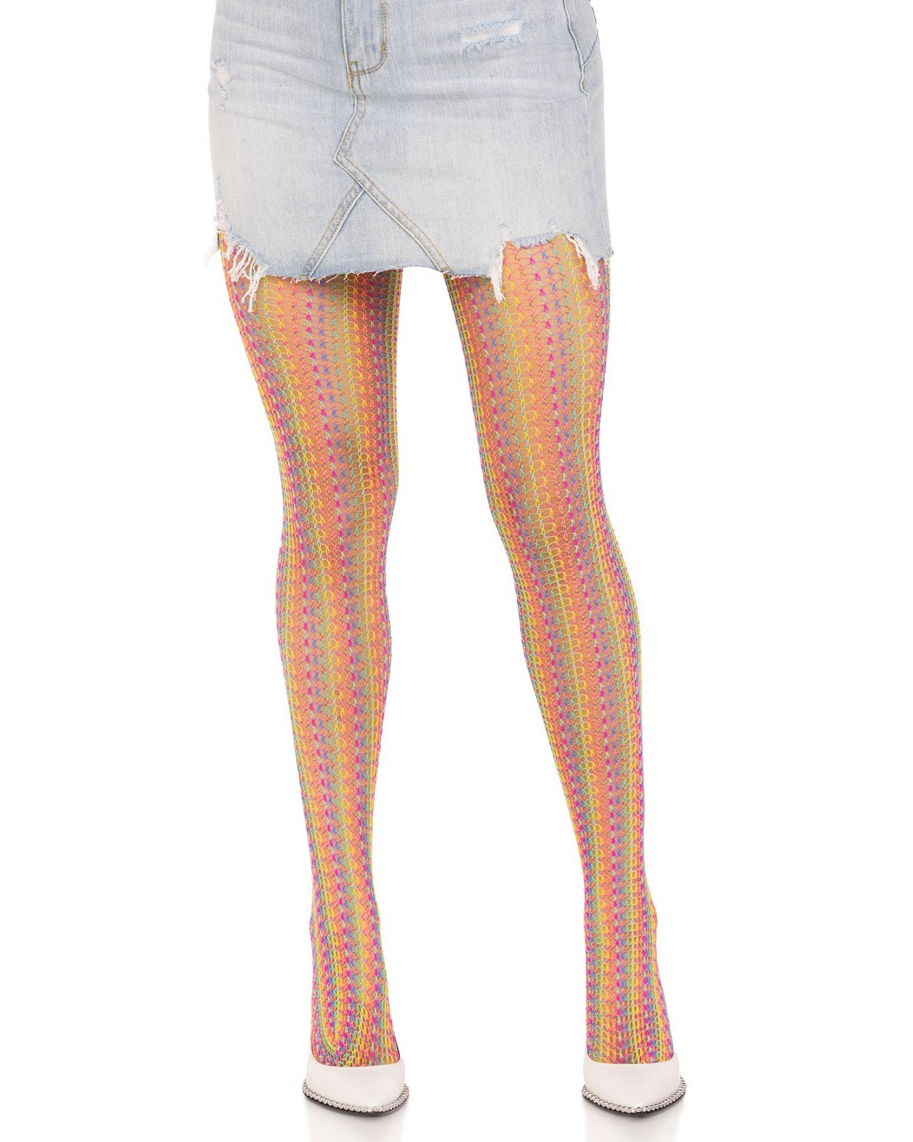 Leg Avenue 9732 Rainbow Crochet Net Tights - Openwork fashion tights with multicoloured vertical crochet style stripes. Side view. Worn with light denim mini skirt and white high heels.