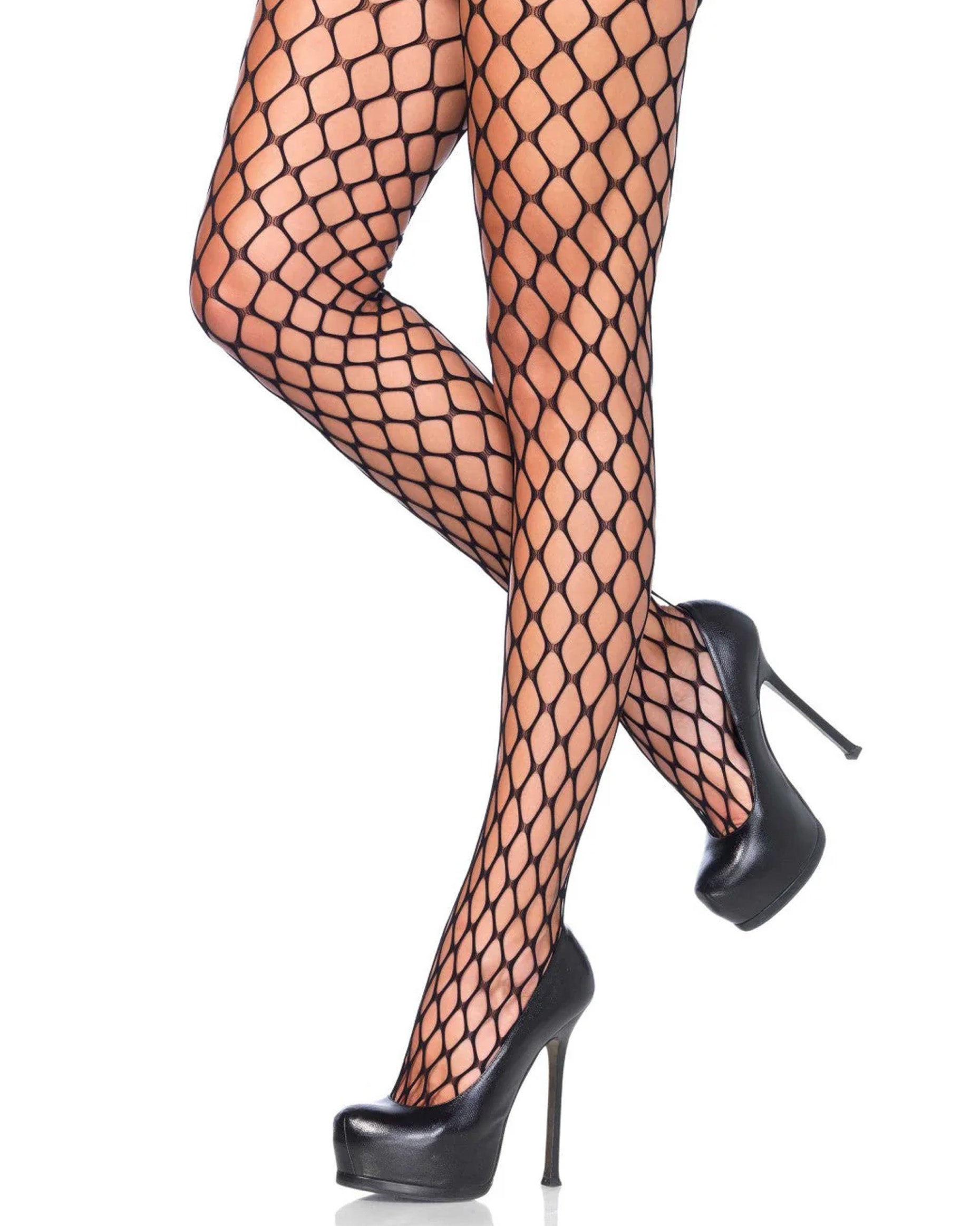 Leg Avenue Sharp Edge Fishnets - Black strong and thick fence fishnet tights. Worn with black stiletto heels.