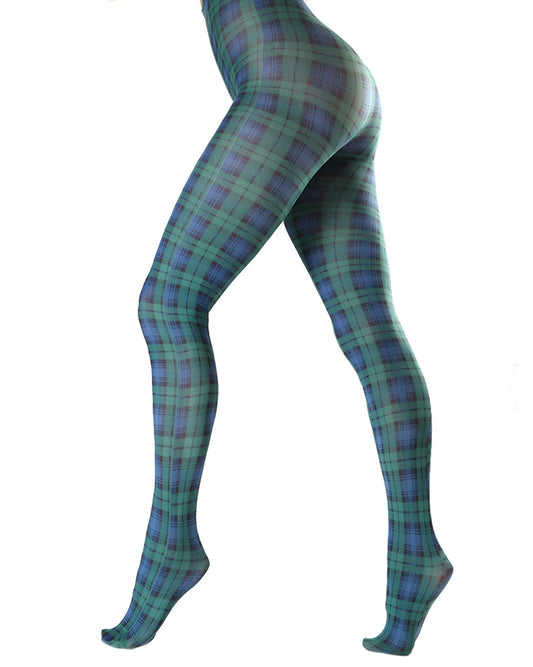 White opaque fashion tights with a green and navy tartan printed pattern. Side view.