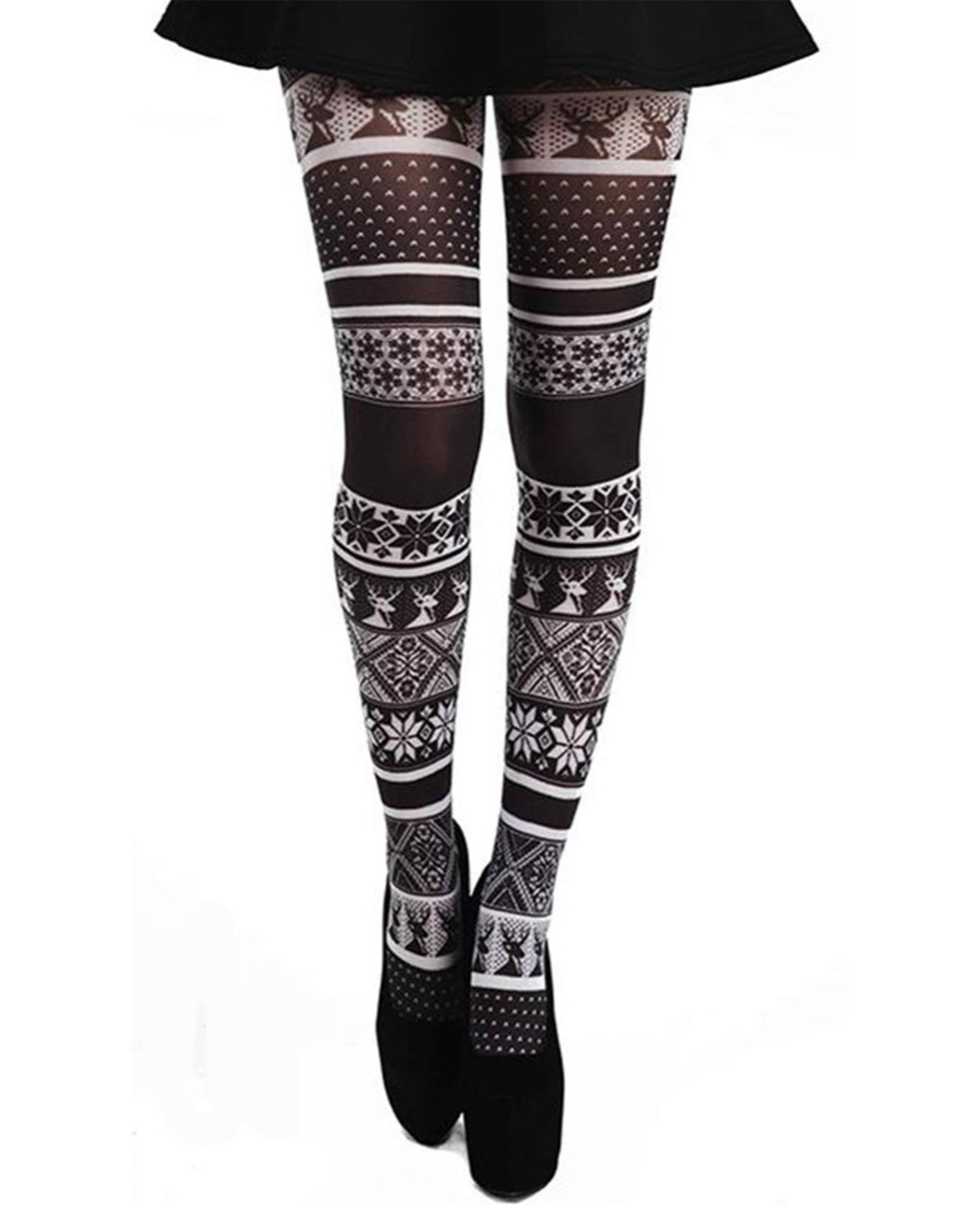 Pamela Mann Fairisle Tights - White semi-opaque tights with a black fairisle print pattern of reindeers and snowflakes. Perfect for Christmas. Worn with black skirt and heels.