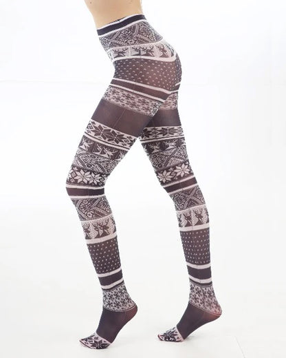 Pamela Mann Fairisle Tights - White semi-opaque tights with a black fairisle print pattern of reindeers and snowflakes. Perfect for Christmas. Side view.