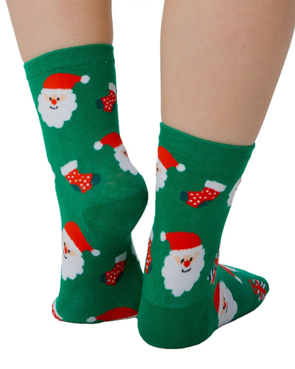 Pamela Mann Santa Socks - Green cotton mix ankle socks with a pattern of Santas, Christmas stockings and presents in red and white. Back view.