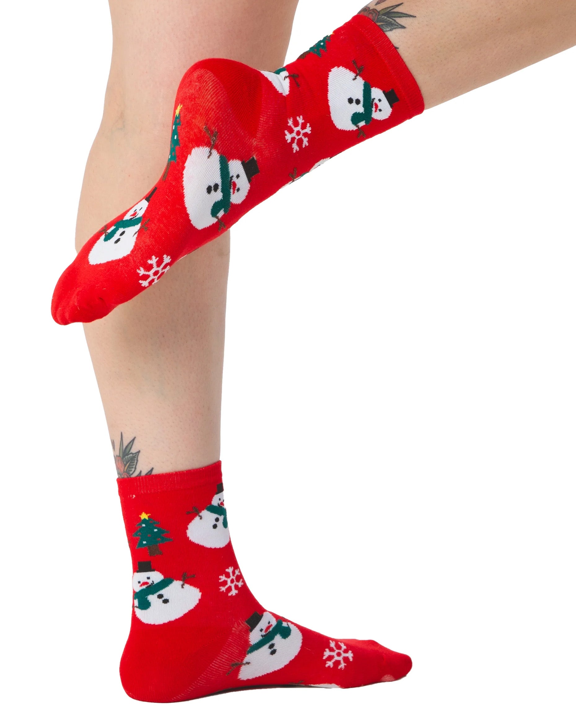 Pamela Mann Snowman Sock - Red cotton mix crew length ankle socks with an all over snowman, snowflakes and Christmas tree pattern. Side view.