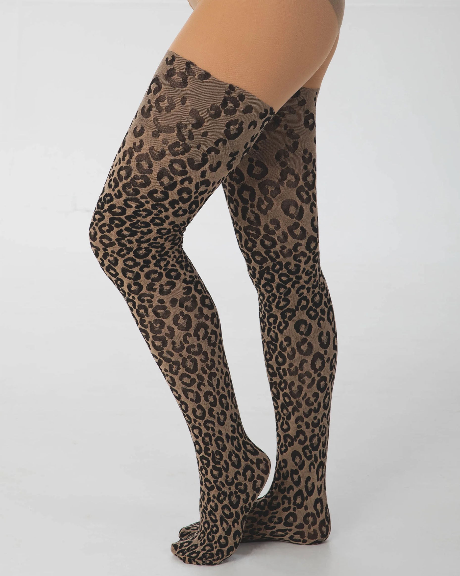 Pamela Mann Woven Leopard Print Tights - Light nude opaque tights with a woven black cheetah print pattern with a plain boxer top. Side view.