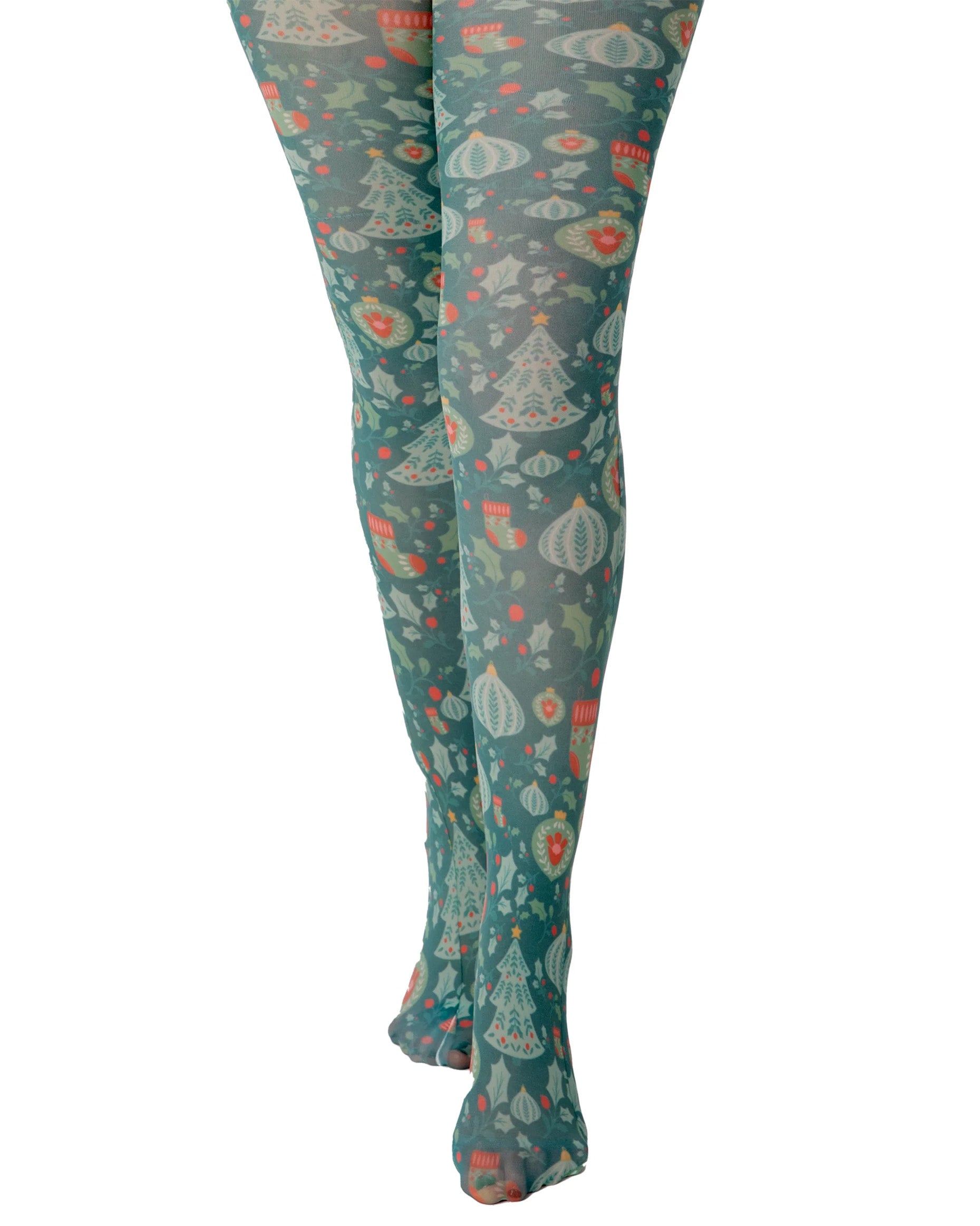 Pamela Mann Christmas Chaos Tights - White opaque tights with a Christmas themed print of Xmas trees, baubles, stockings & holly in shades of green and red.