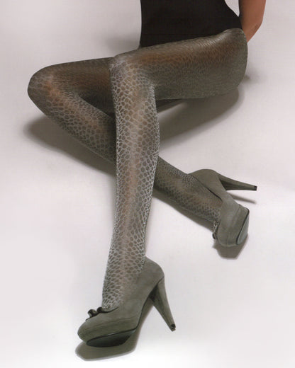 Silvia Grandi Kobra Collant - Semi-opaque silver grey fashion tights with a reptile style pattern, glossy finish, hygienic cotton gusset, fat seams and comfort waist band. Worn with back body top and grey high heels.