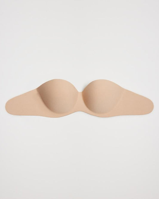 Ysabel Mora 10142 Adhesive Bra - Natural nude light push-up reusable adhesive bra. This bra is strapless and backless and adheres to the chest and sides, ideal for dresses and open back tops.