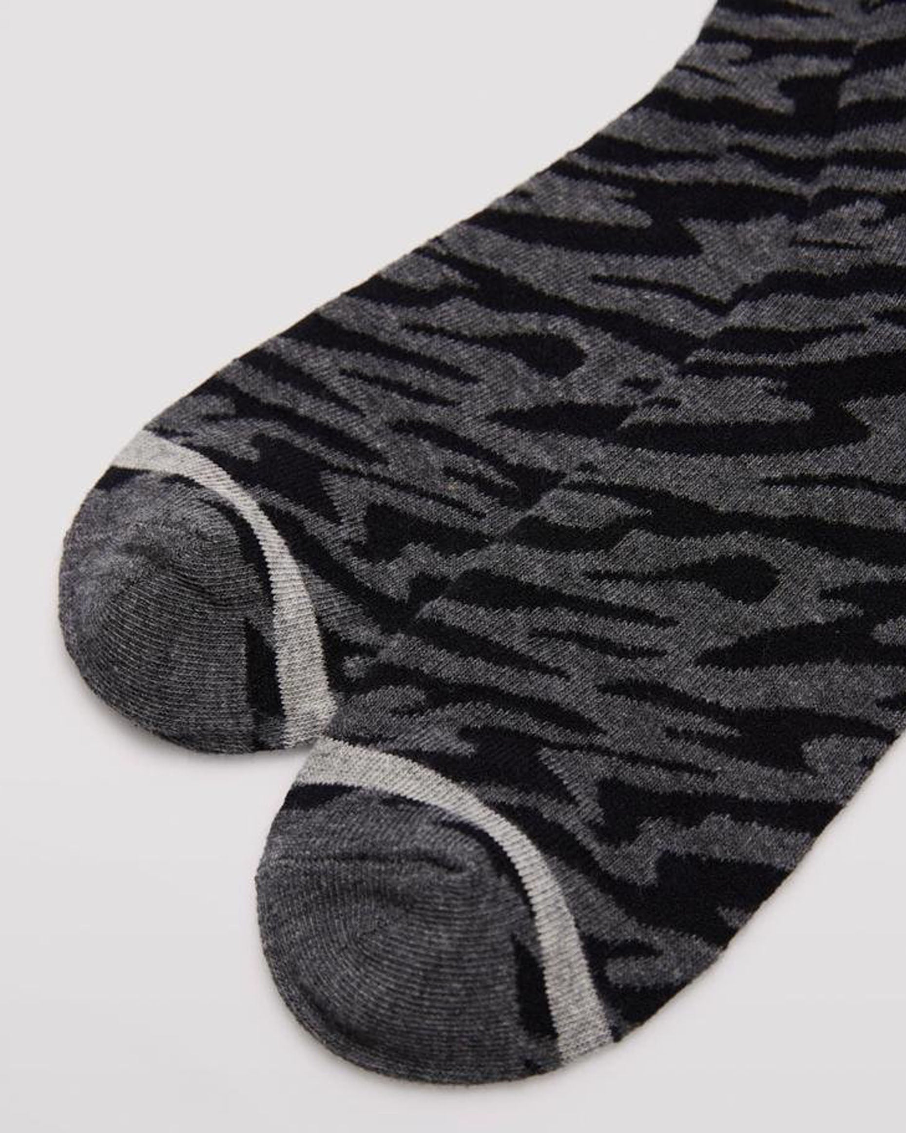 Ysabel Mora 12207 Zebra Socks - Dark grey crew length cotton ankle socks with an all over zebra print pattern on black with light grey stripe toe, flat toe seam detail.