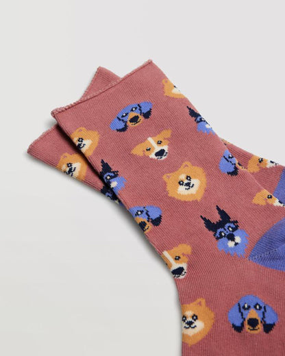 Terracotta coloured cotton ankle sock with an assorted dog face pattern, contrast heel and toe and no cuff edge roll.