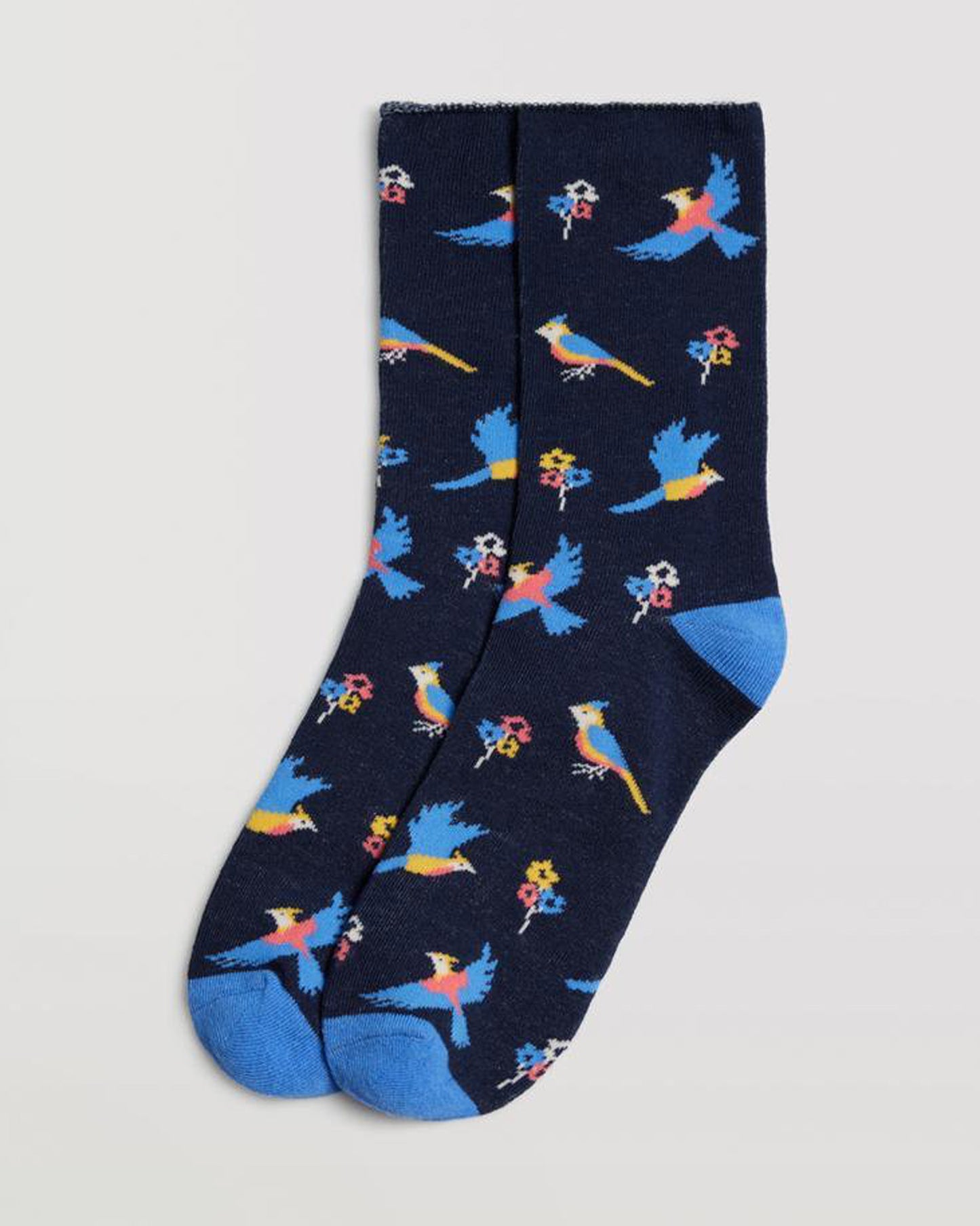 Ysabel Mora 12881 Bird Socks - Navy cotton socks with an all over multicoloured bird and flower pattern in sky blue, yellow, pale pink and white with a sky blue toe and heel and no cuff.