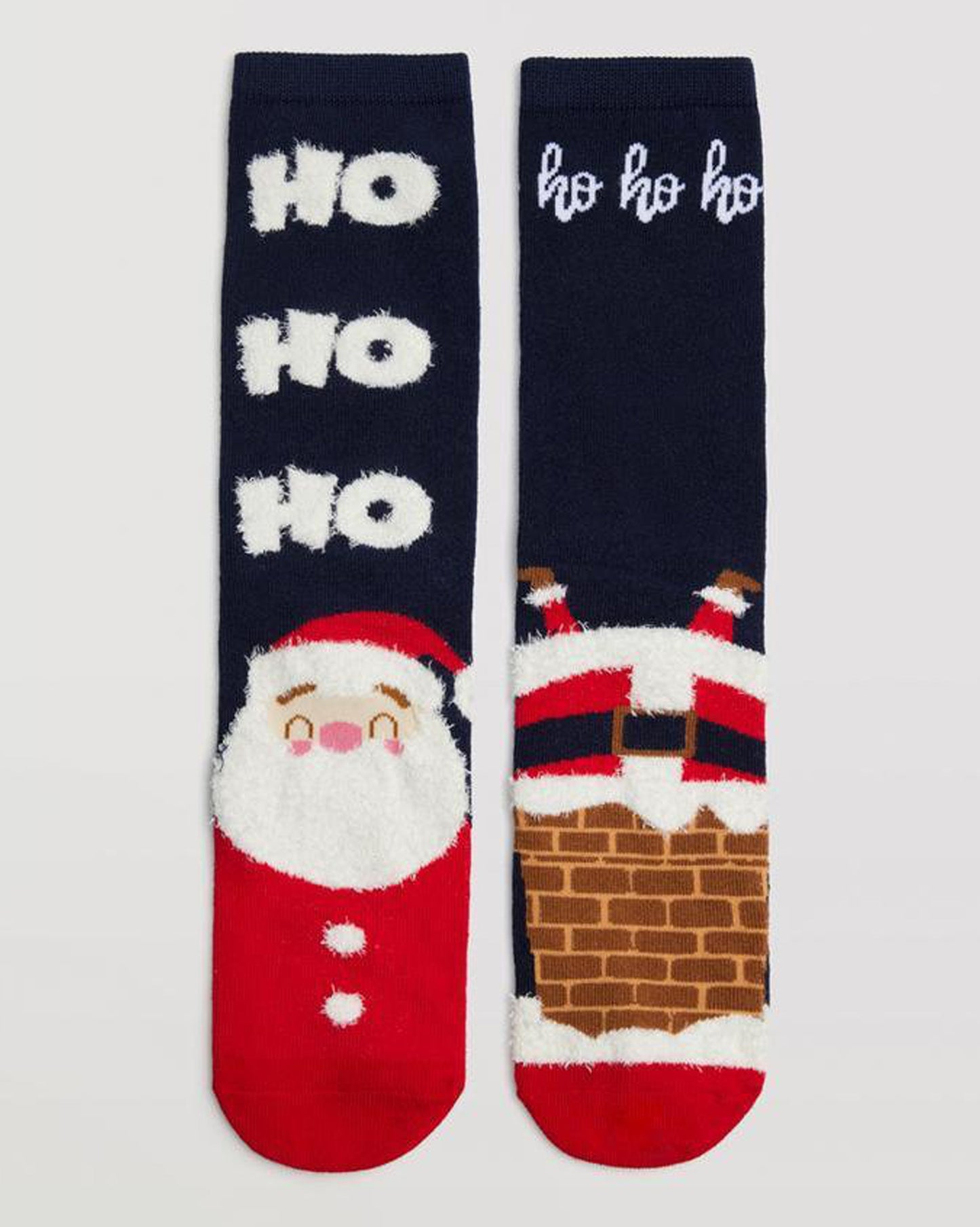 Ysabel Mora 12901 Santa Socks Gift Box 2 Pk - navy socks with an upside down Santa in a chimney on one sock and has an upright Santa with a fluffy beard and the text "ho ho ho".