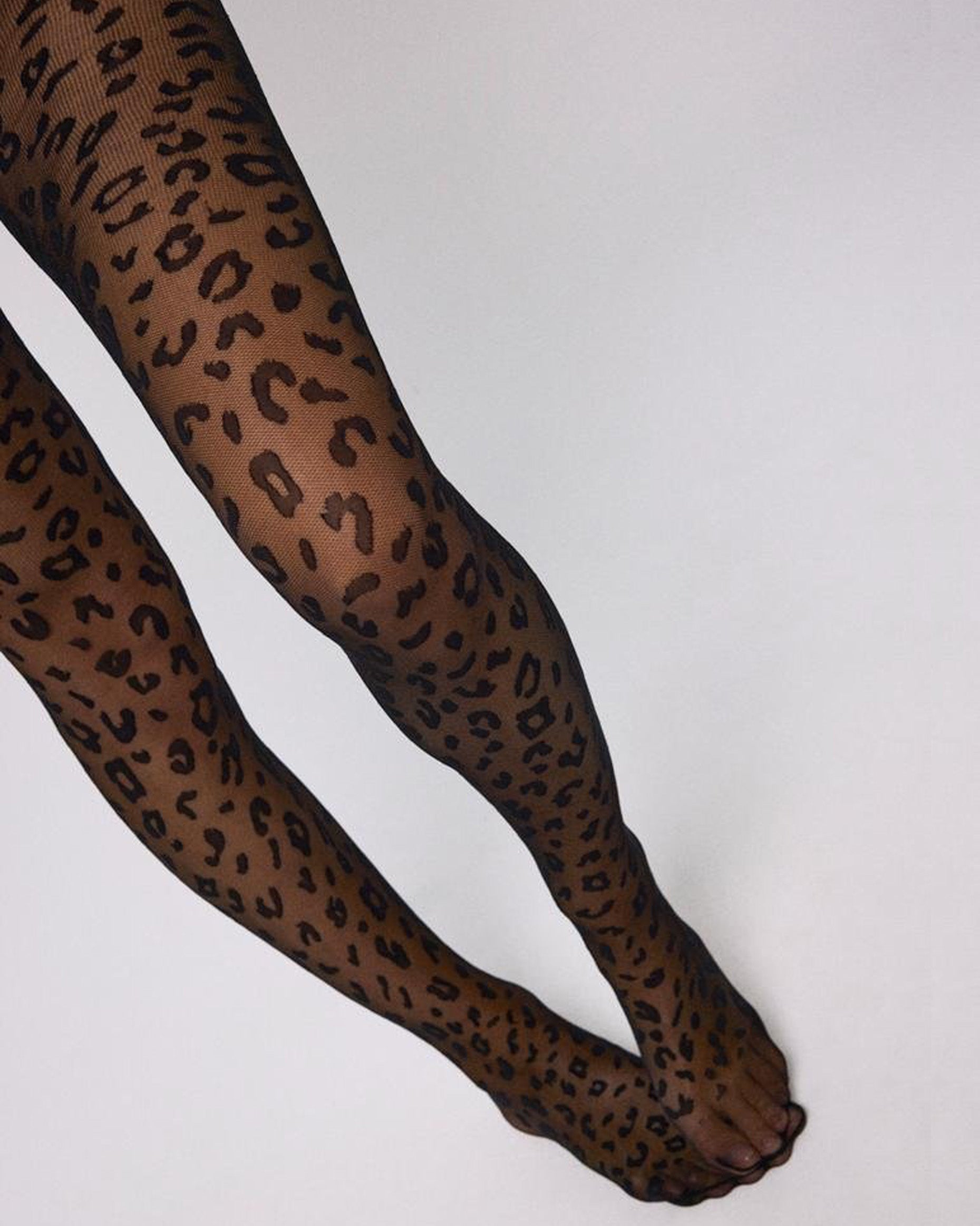 Ysabel Mora 16613 Leopard Print Tights - Sheer black micro mesh fashion tights with a woven black leopard style pattern.