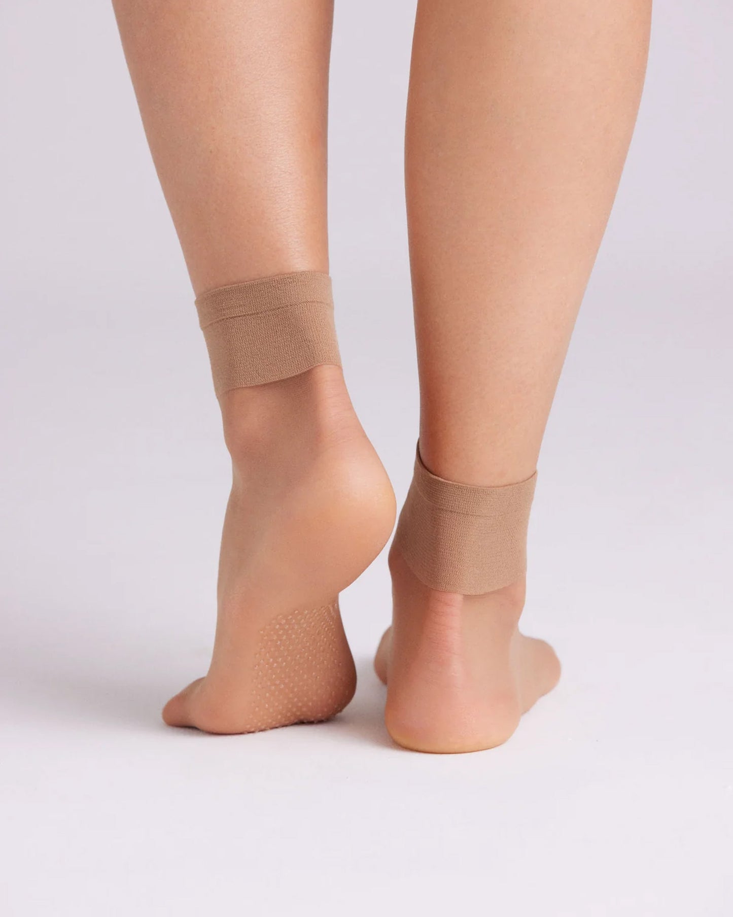 Ysabel Mora 18125 Grip Sole Socks - Sheer natural tan classic ankle socks with a dotted silicone grip sole and deep elasticated comfort cuff. Back view.