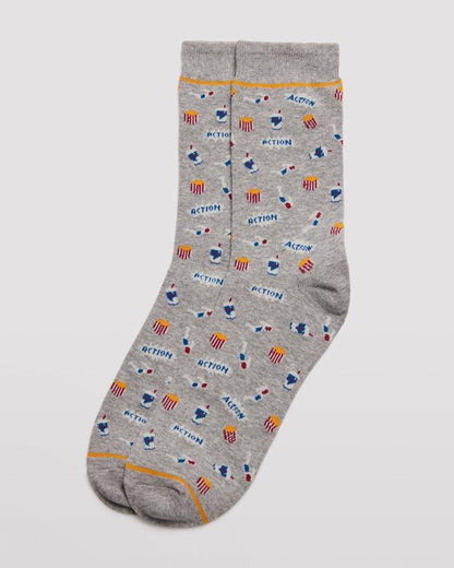 Ysabel Mora 22155 3D Movie Socks - Light grey crew length men's cotton ankle socks with an all over pattern of 3D glasses, tubs of popcorn, drink and the word "action", yellow stripe on cuff and toe, flat toe seam, shaped heel and deep comfort cuff.