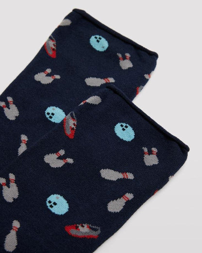 Ysabel Mora 22160 Bowling SockMen's navy cotton crew ankle socks with an all over bowling themed pattern of bowling balls, shoes and pins with no cuff roll top anti-pressure edge. Close up detail.