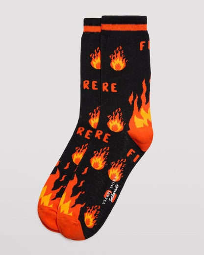 Ysabel Mora 22175 Fire Sock - Men's black cotton crew length ankle socks with an all over pattern of fire and flames in orange and yellow, orange stripe on cuff, orange heel and toe with soft anti-pressure cuffs.