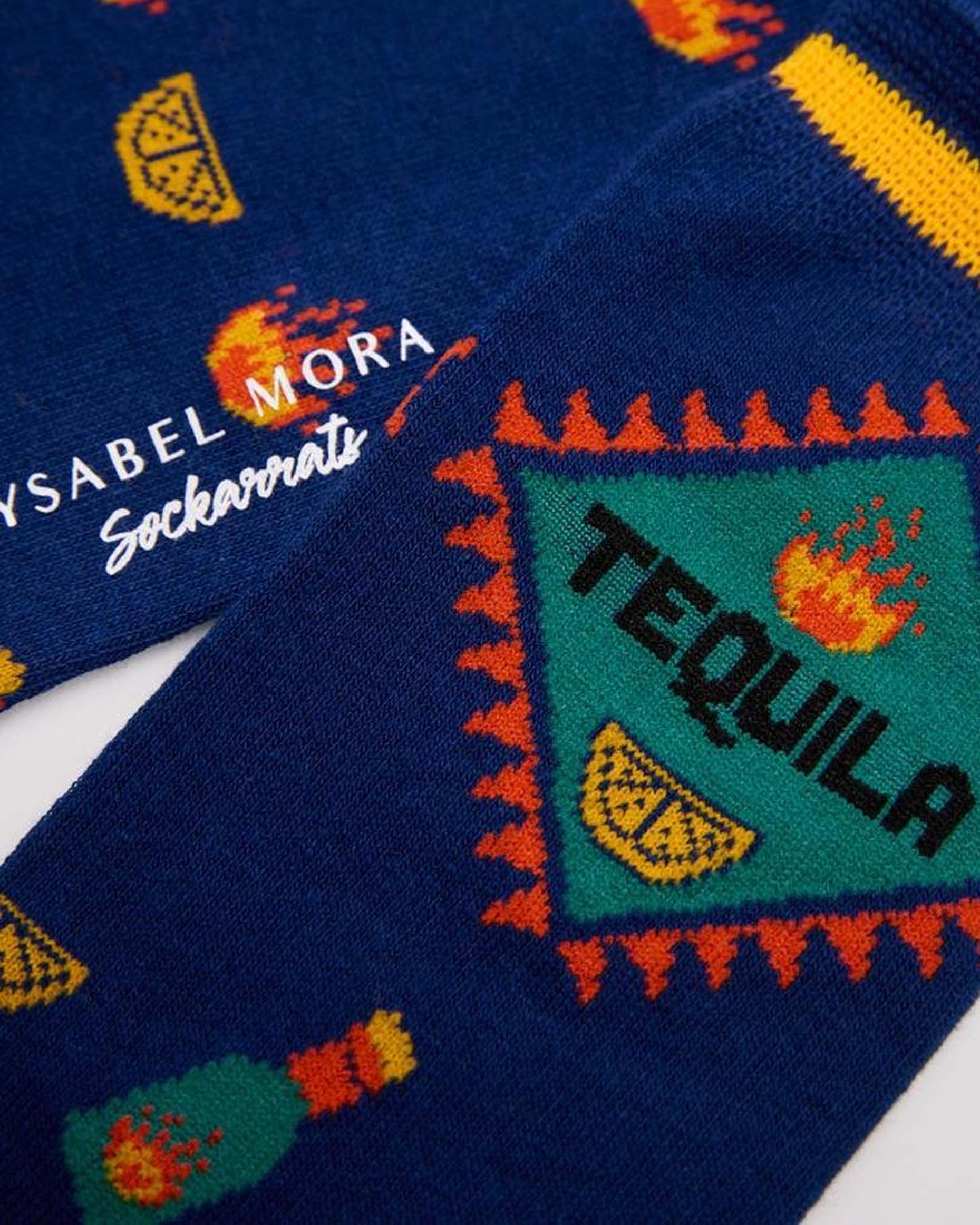 Ysabel Mora 22175 Tequila Sock - Navy cotton crew length ankle socks with an all over tequila themed pattern of tequila bottles, slices of lemons, fire flames, light blue heel and toe with soft anti-pressure cuffs. Close up detail.