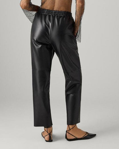 Ysabel Mora 70418 Faux Leather Pants - Loose fitting black faux leather thermal trousers with side pockets, elasticated waistband, drawstrings, taped leg and soft, warm plush fleece lining. Back view.