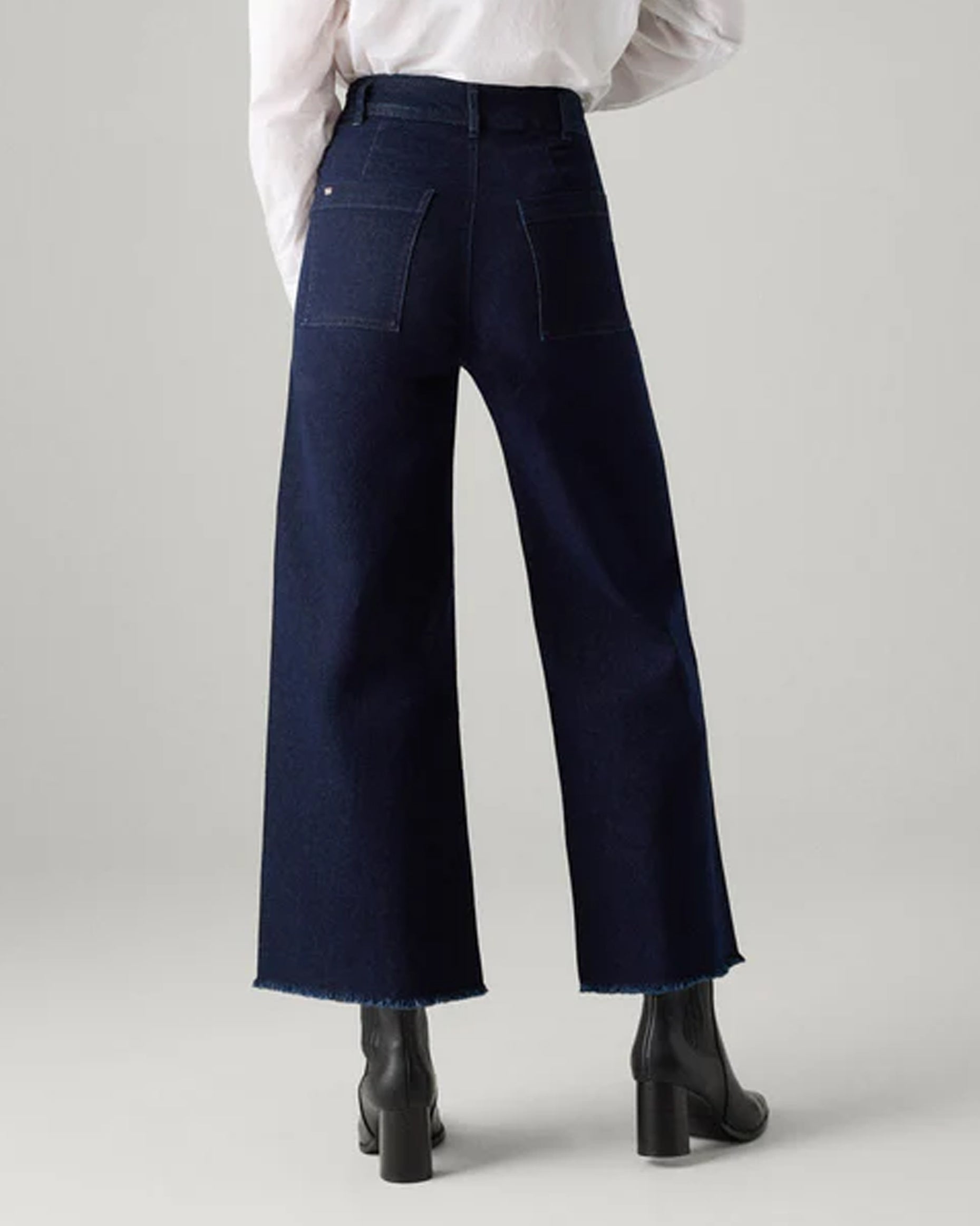 Ysabel Mora 70428 Wide Leg Jeans - Dark denim wide leg high waisted denim jeans with stretch and raw edge. Back view.