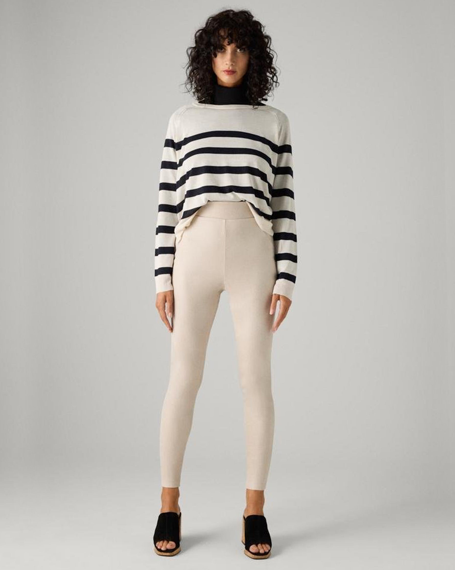 Ysabel Mora 70433 Metallic Suede Leggings - Cream coloured soft high rise faux suede leggings with a metallic velour finish deep elasticated high waist band. Worn with white and black stripe jumper and black muled heels.