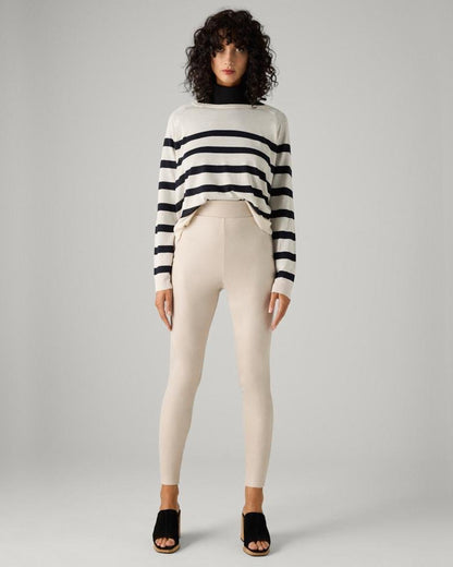 Ysabel Mora 70433 Metallic Suede Leggings - Cream coloured soft high rise faux suede leggings with a metallic velour finish deep elasticated high waist band. Worn with white and black stripe jumper and black muled heels.