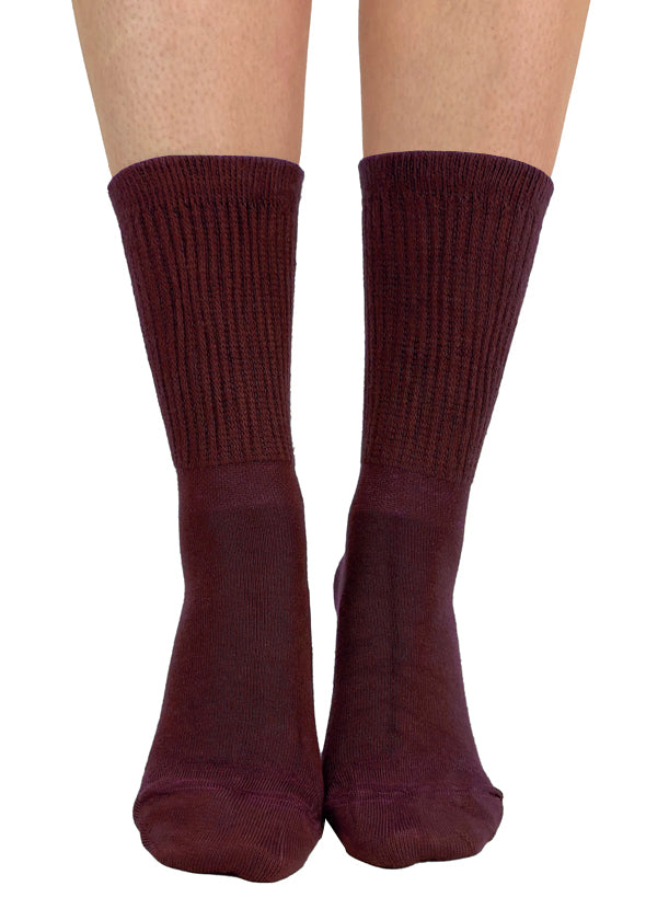 Soft and breathable burgundy wine bamboo slouch socks with a loose knitted rib top, ankle and foot support and flat toe seams.