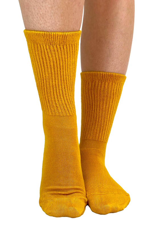 Soft and breathable mustard bamboo slouch socks with a loose knitted rib top, ankle and foot support and flat toe seams.