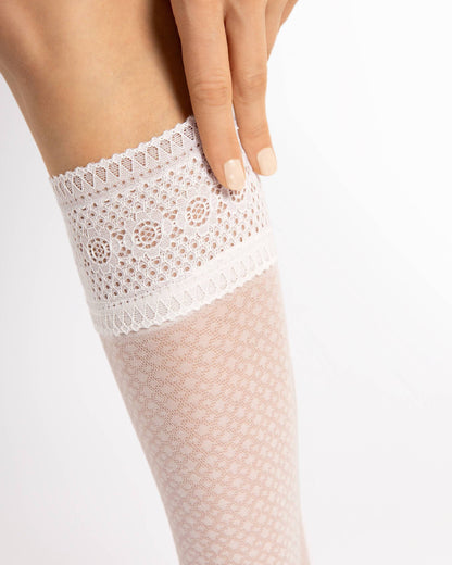 Fiore Bravo 20 Den Sock - Sheer off white dotted diamond style patterned knee-high socks with a deep embroidered lace cuff with silicone. Detail of cuff.