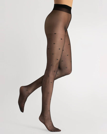 Fiore Confetti Tights - Sheer black fashion tights with a woven sparkly gold polka dot pattern. Side view.