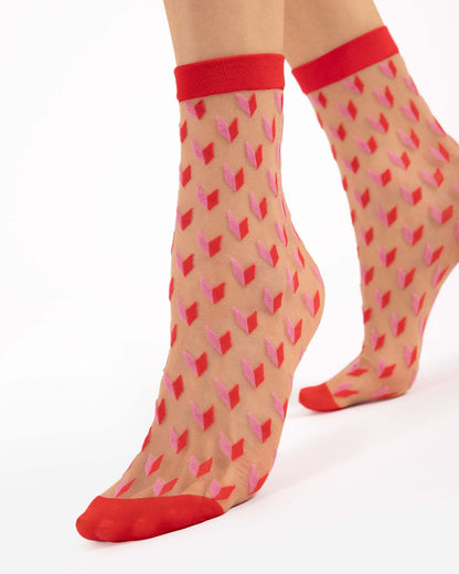 Fiore Dizzy Socks - Sheer nude fashion ankle socks with an all over cube heart style pattern in red and light pink, red toe and cuff.