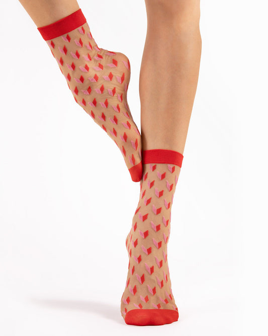 Fiore Dizzy Socks - Sheer nude fashion ankle socks with an all over cube heart style pattern in red and light pink and a plain red cuff.