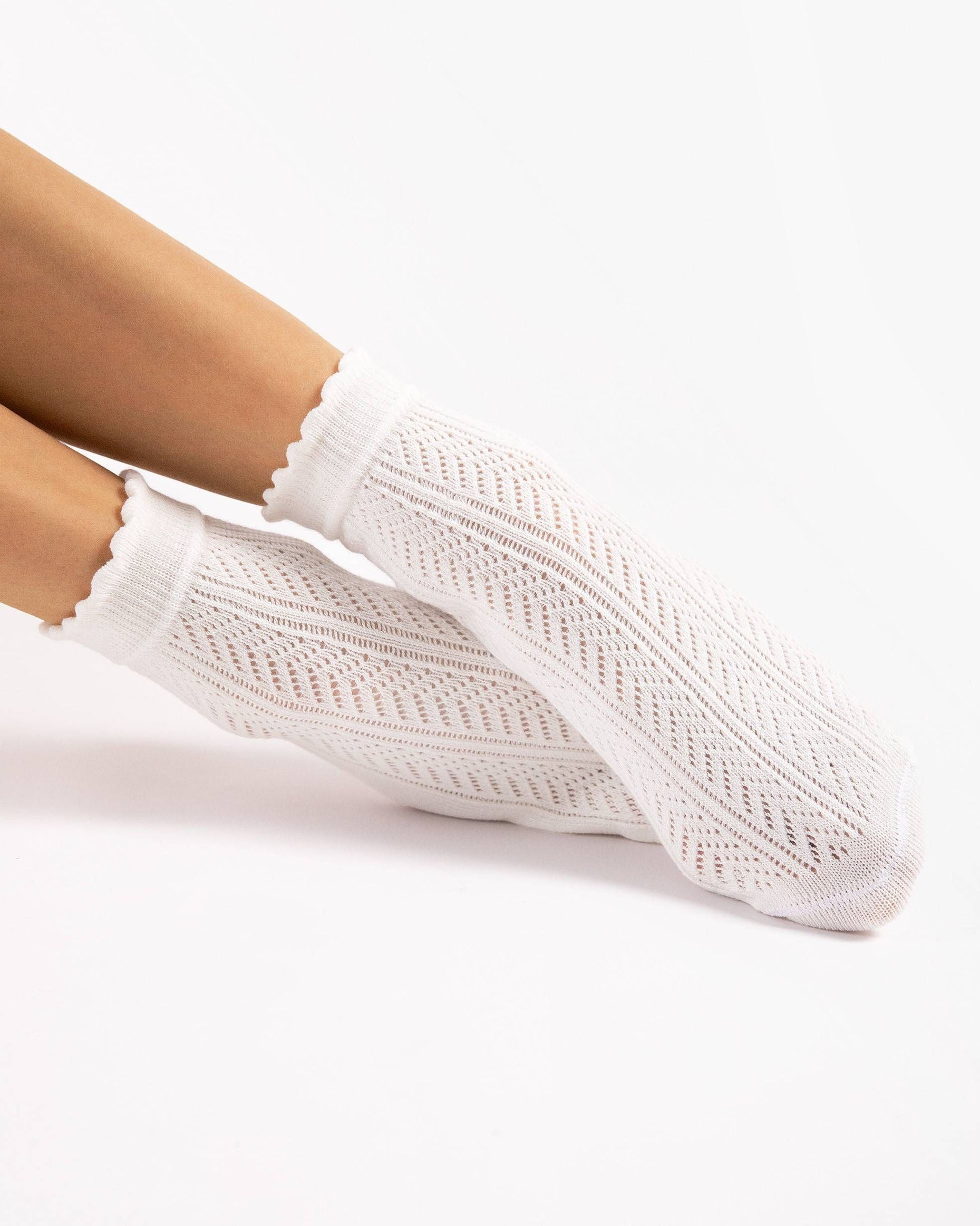 Fiore Laylah Sock - Openwork ivory fashion ankle socks with a crochet chevron/herringbone stripe style pattern, comfort cuff with a frill scalloped edge and plain sole. Side view.