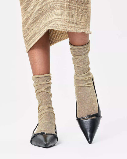 Happy Socks Glitter Crinkle Sock - Sparkly gold light weight long socks that can be slouched or scrunched down, worn with black point toe shoes and knitted beige skirt.