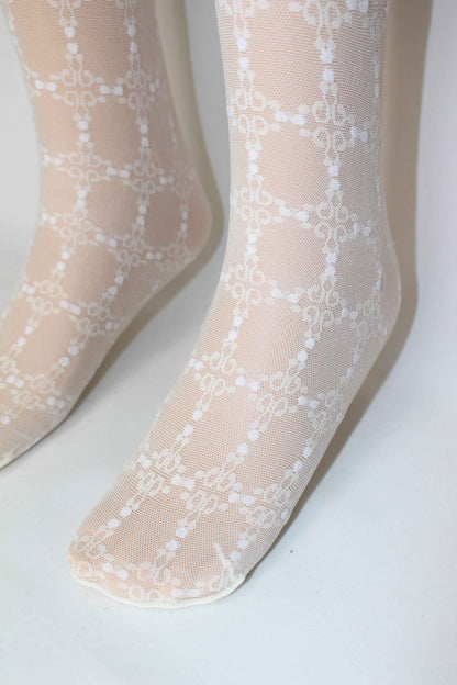 Omsa Serenella Decor Collant - Ivory / cream semi sheer micro mesh children's fashion tights with a woven lace style grid pattern with white dots.