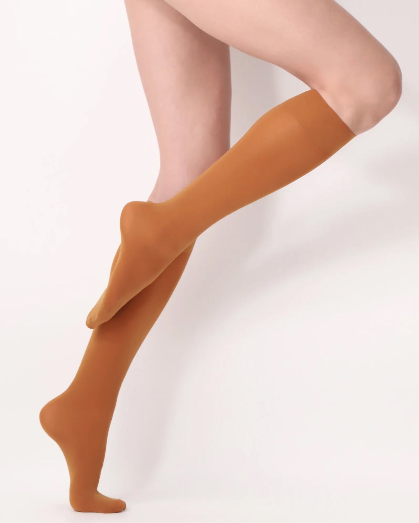 Oroblù All Colors Knee-Highs - Soft opaque rust orange knee-high socks with a soft deep elasticated comfort cuff. Side view.