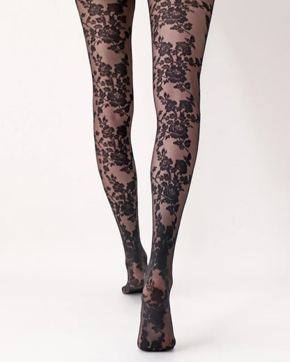 Oroblù Classy Lace Tights - Sheer black micro-mesh fashion tights with a woven floral lace pattern, flat seams, gusset and deep elasticated waist band. Back view.