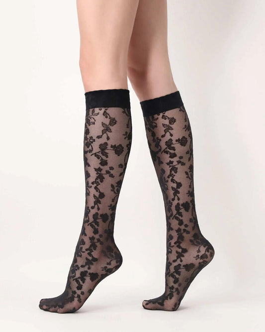 Oroblù Shaded Roses Knee-Highs - Sheer black fashion knee-high socks with a woven floral lace style pattern and scalloped edge elasticated cuff. Side view.