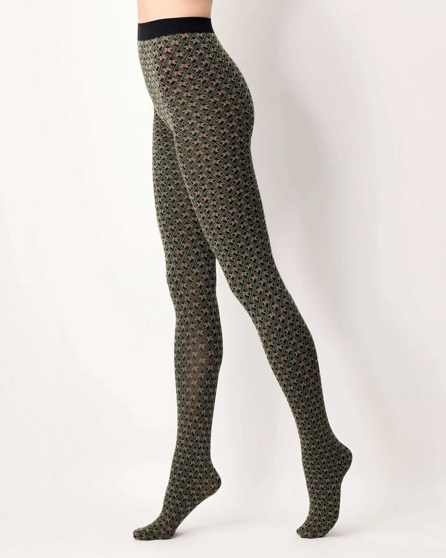 Oroblù Tiny Patterns Tights - Black opaque fashion tights with a woven floral and diamond Victorian tile style pattern in khaki green and pale dirty pink, gusset and soft elasticated waist band. Side view.