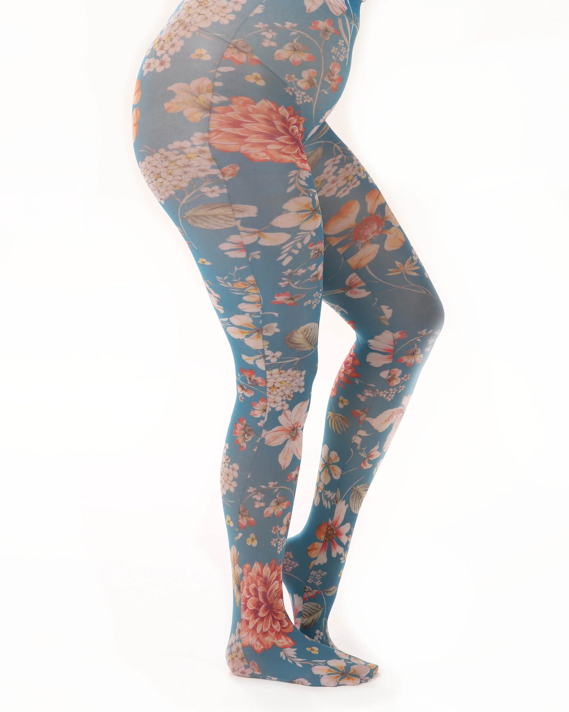 Pamela Mann Exotic Floral Print Tights - White opaque fashion tights with a floral printed pattern with teal blue background and multicoloured flowers. Side view.