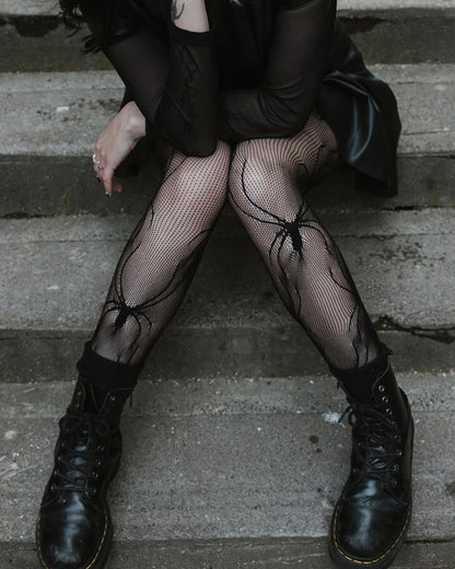 Pamela Mann Spider Net Tights - Black openwork fishnet tights with an all over spider design, worn with doc martin boots and leather skirt and sheer top.