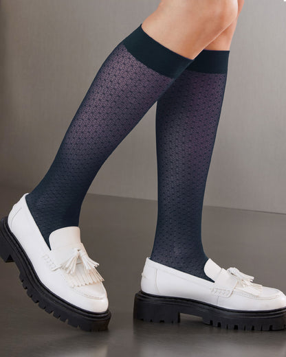 SiSi Point Gambaletto - Sheer navy blue micro-mesh fashion knee-high socks with a circular dotted vertical stripe style pattern and plain deep comfort cuff. Worn with white loafers.