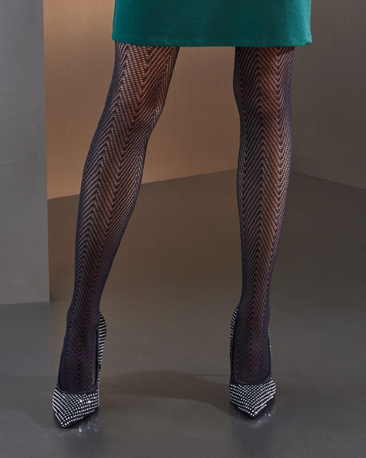 SiSi Smoky Collant - Black semi opaque micro-mesh fashion tights with a large chevron/herringbone knit style pattern. Worn with green skirt and diamanté high heel shoes.