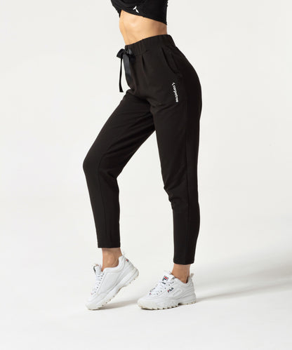 Carpatree Ultimate Tied Sweatpants - Black jogger style tracksuit bottoms with ribbon tie, elasticated waist and pockets. Made of strong stretch cotton.