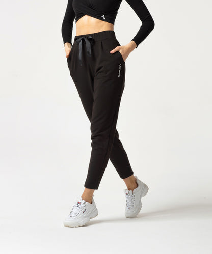 Carpatree Ultimate Tied Sweatpants - Black jogger style tracksuit bottoms with ribbon tie, elasticated waist and pockets. Made of strong stretch cotton.